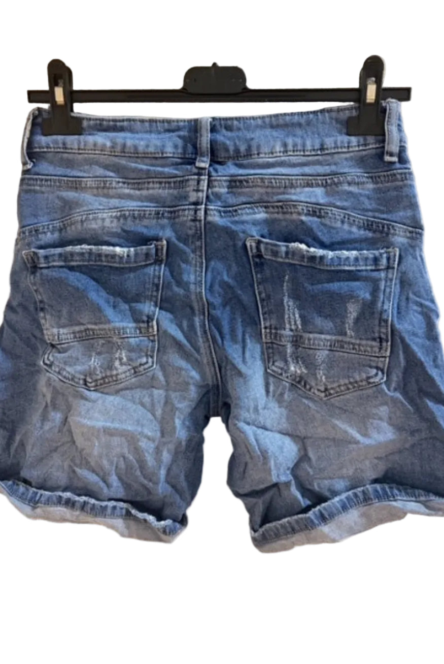 Blue denim shorts on a hanger