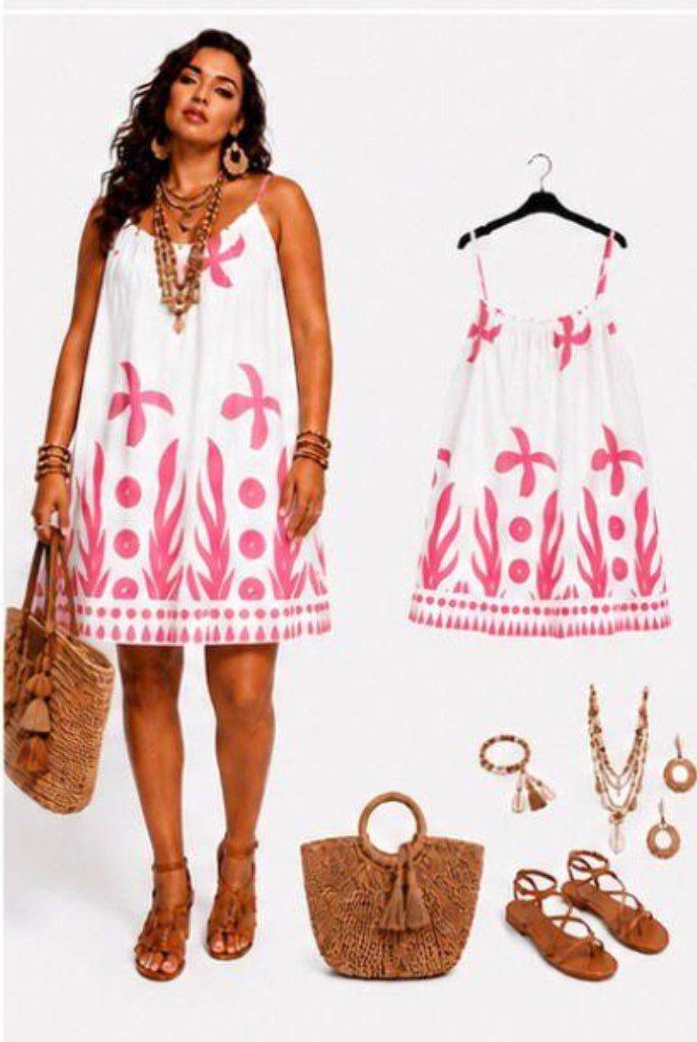 Woman wearing a white dress with pink floral patterns,