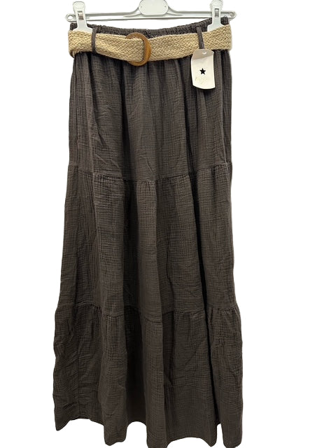 Brown plaid skirt with a belt on a hanger against a white background