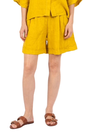 Woman wearing a yellow outfit on a white background