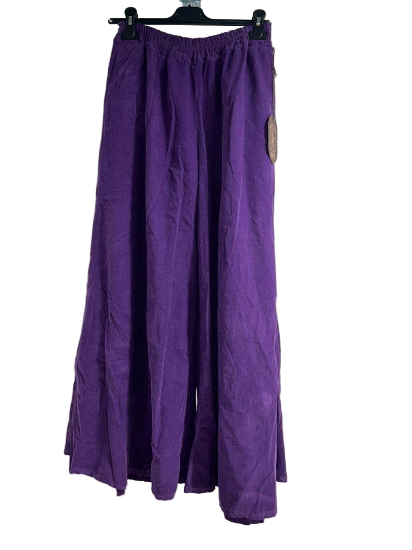 Purple pants on a hanger against a white background