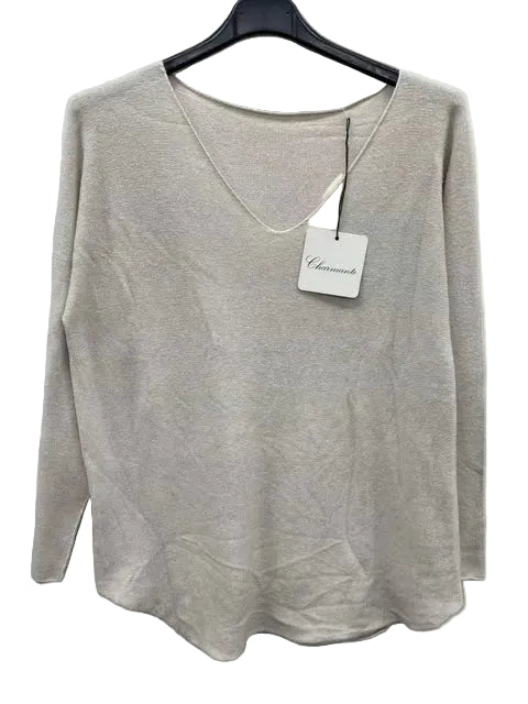 ecru sweater on a hanger with a brand tag against a white background