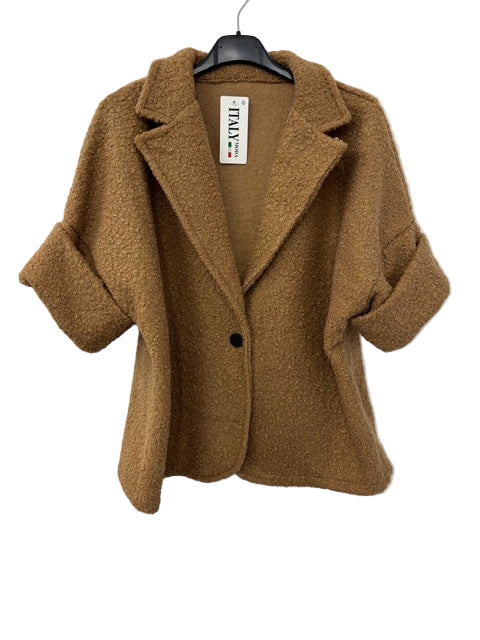 Brown coat on a hanger against a white background