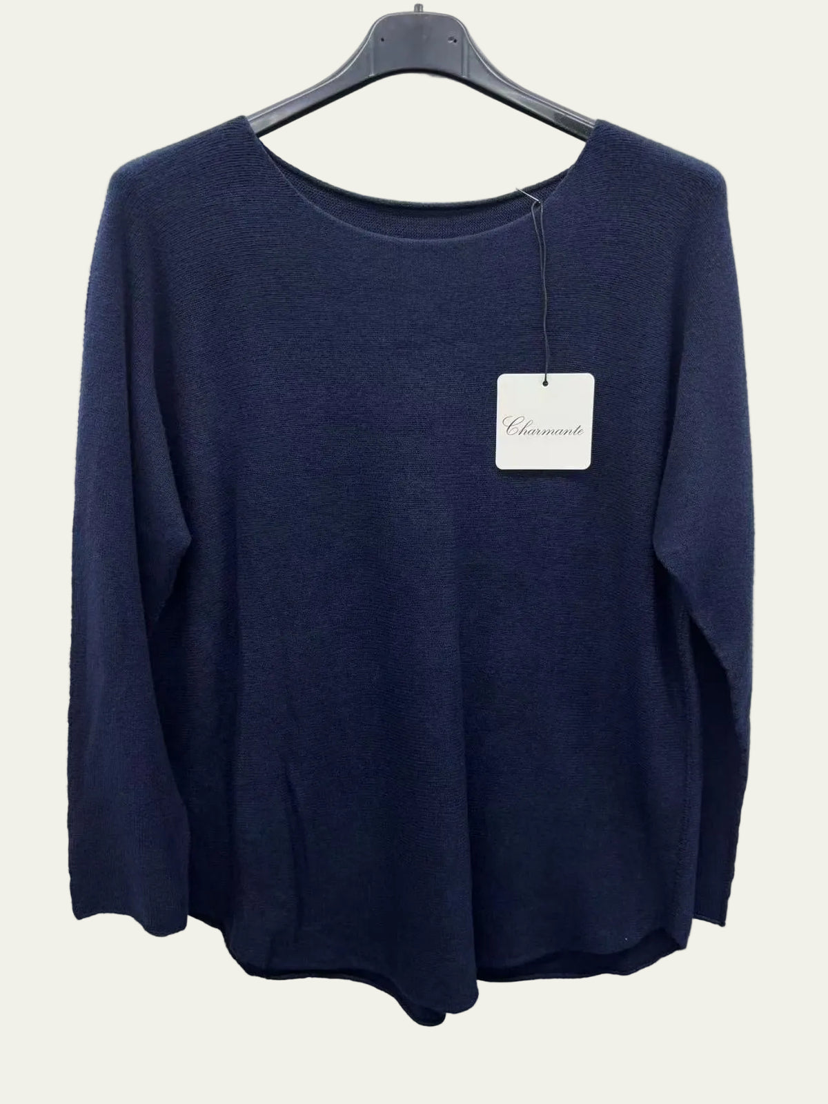 Navy blue sweater on a hanger
