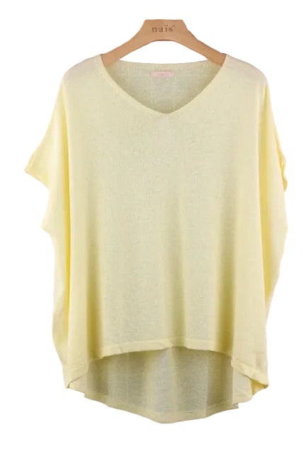 Light yellow sweater on a wooden hanger
