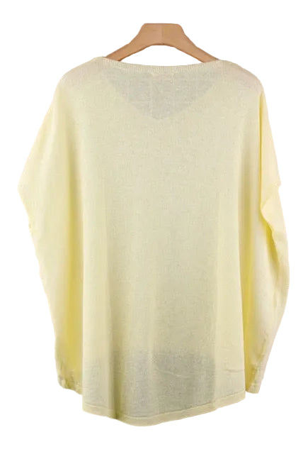 Light yellow top on a wooden hanger