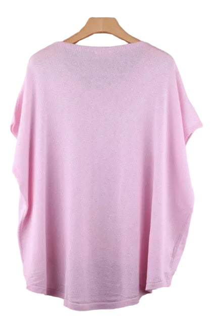 Pink top on a wooden hanger