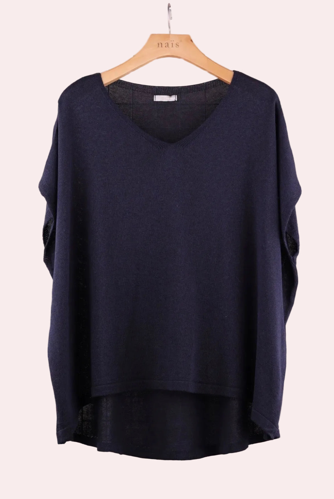 Navy blue sweater on a wooden hanger
