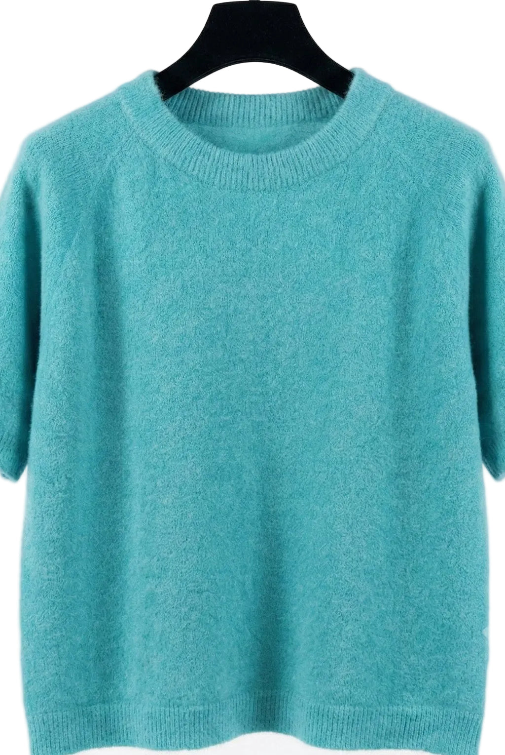 Teal sweater on a hanger against a white background