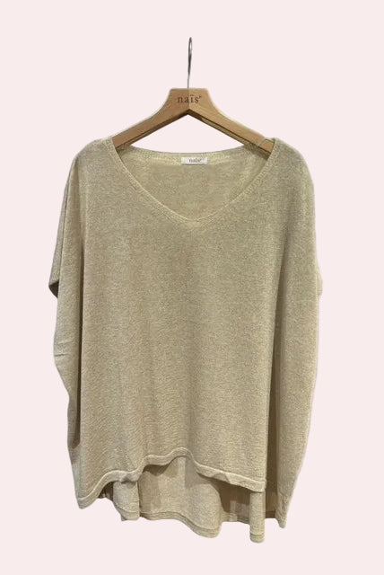 Beige sweater on a wooden hanger