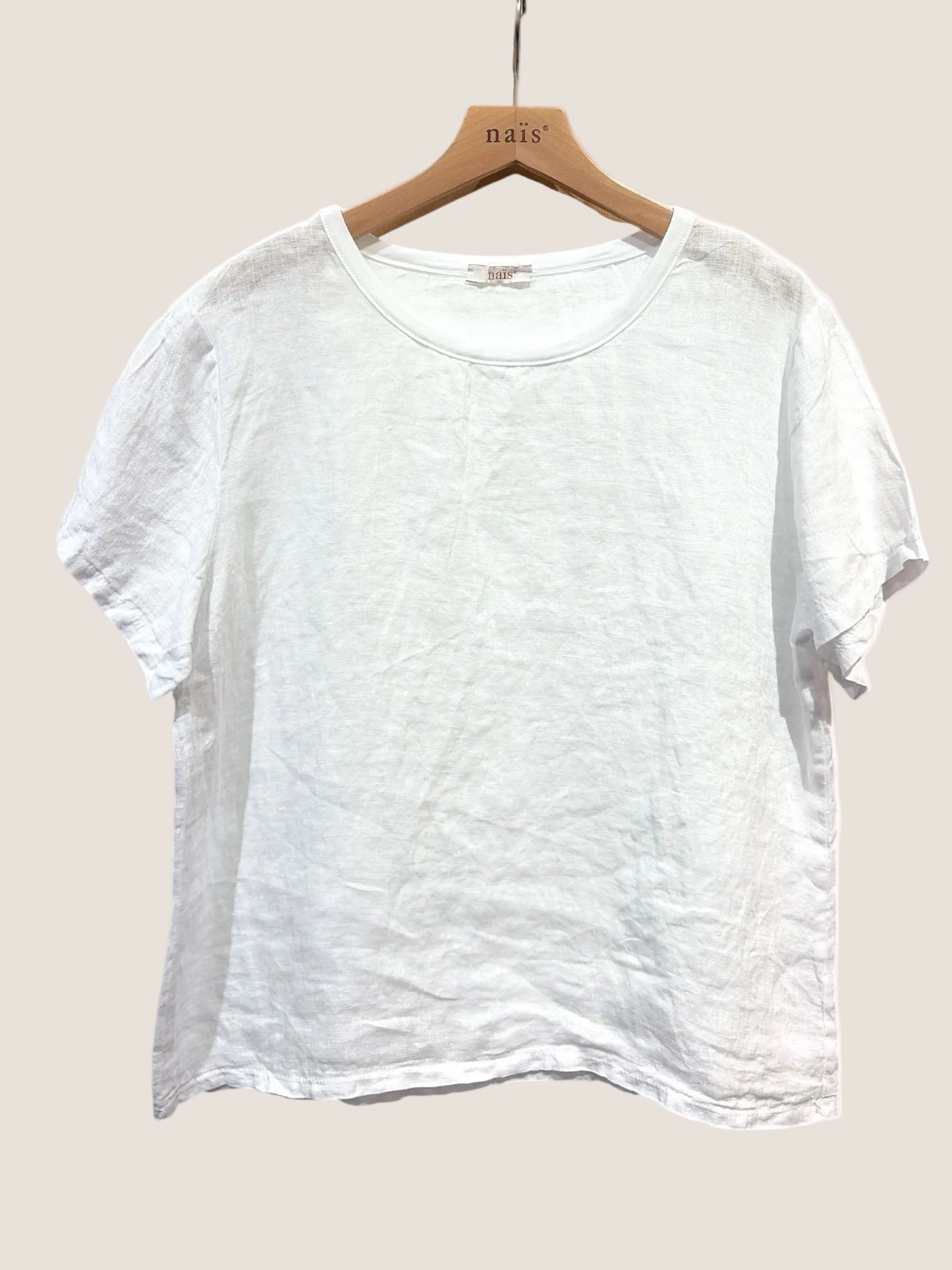 White linen t-shirt on a wooden hanger