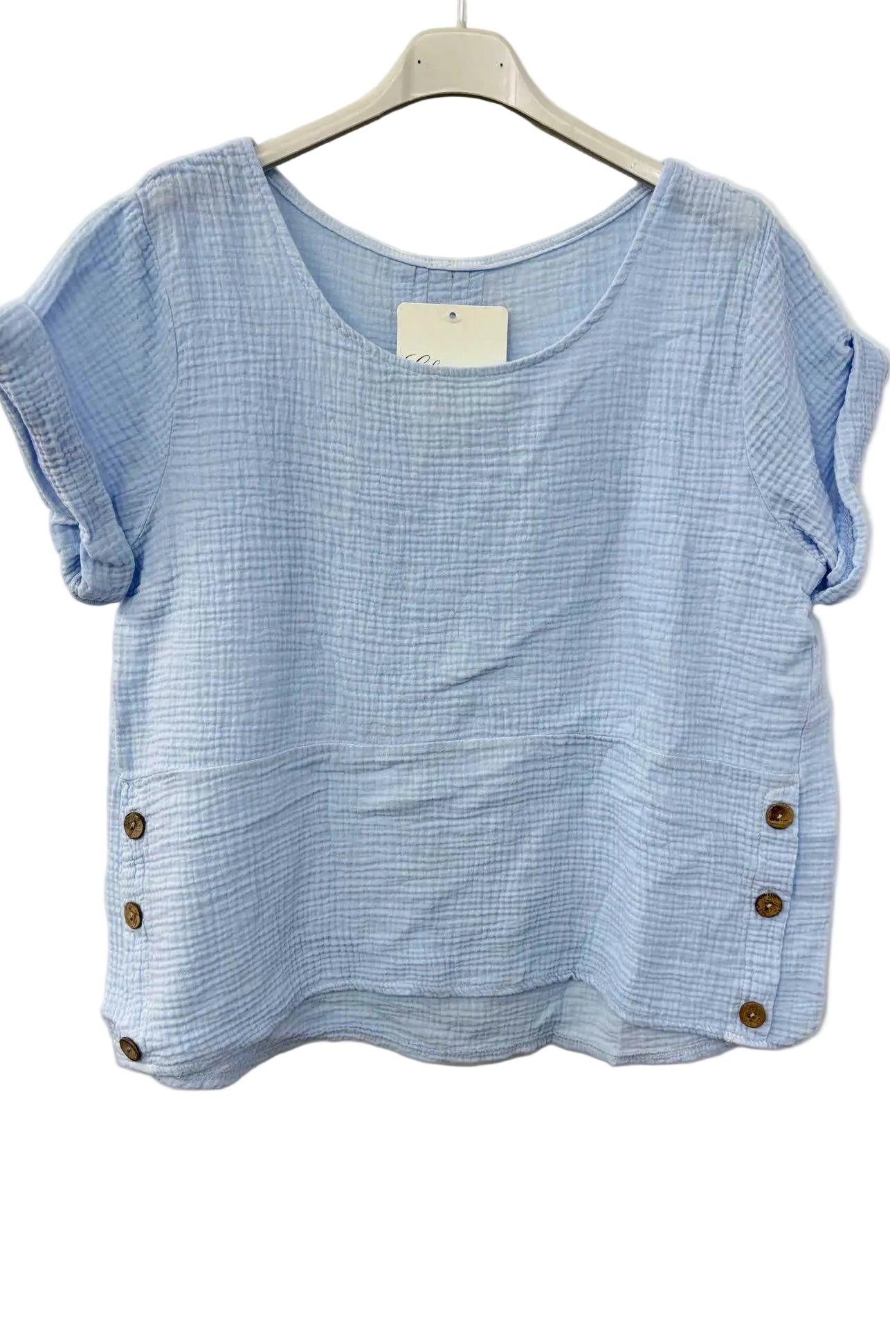 Blue cotton gauze top with button details on a white background