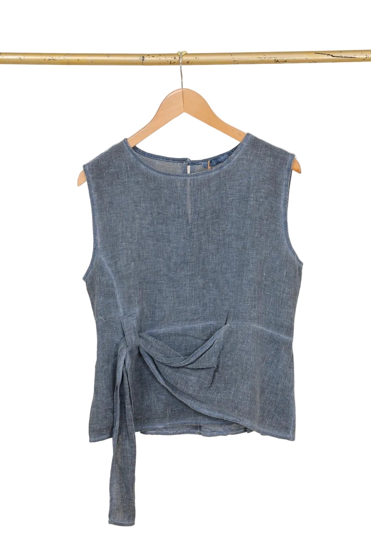 Navy blue sleeveless top with a knot detail on a wooden hanger against a white background