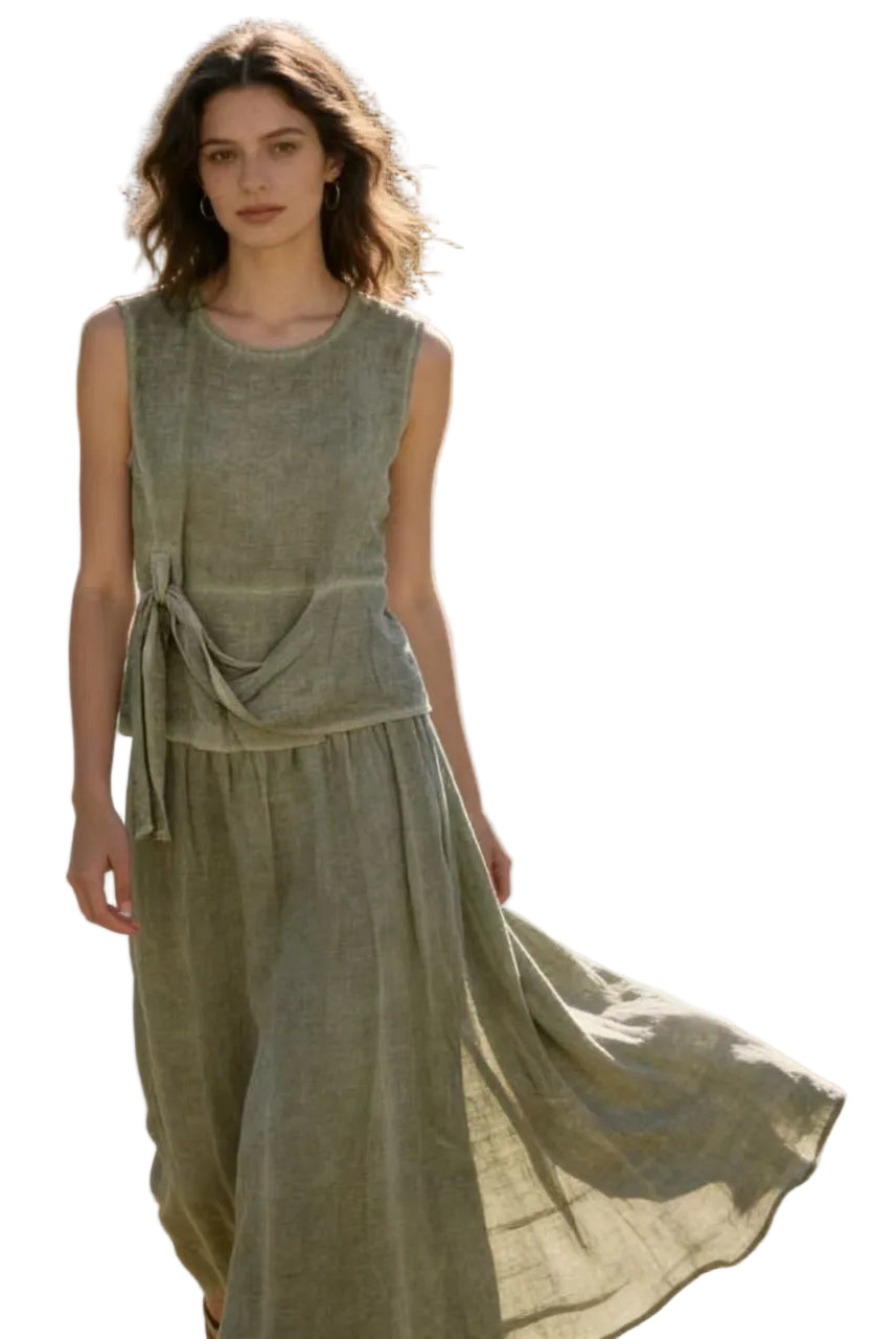 Woman in a khaki linen top & skirt with white background