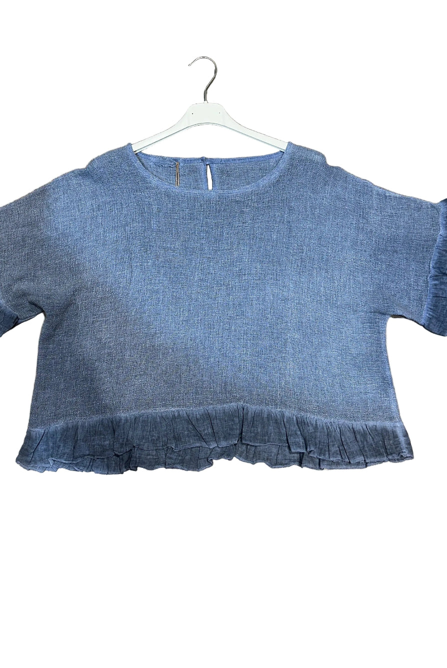 Navy Blue ruffled blouse on a white background