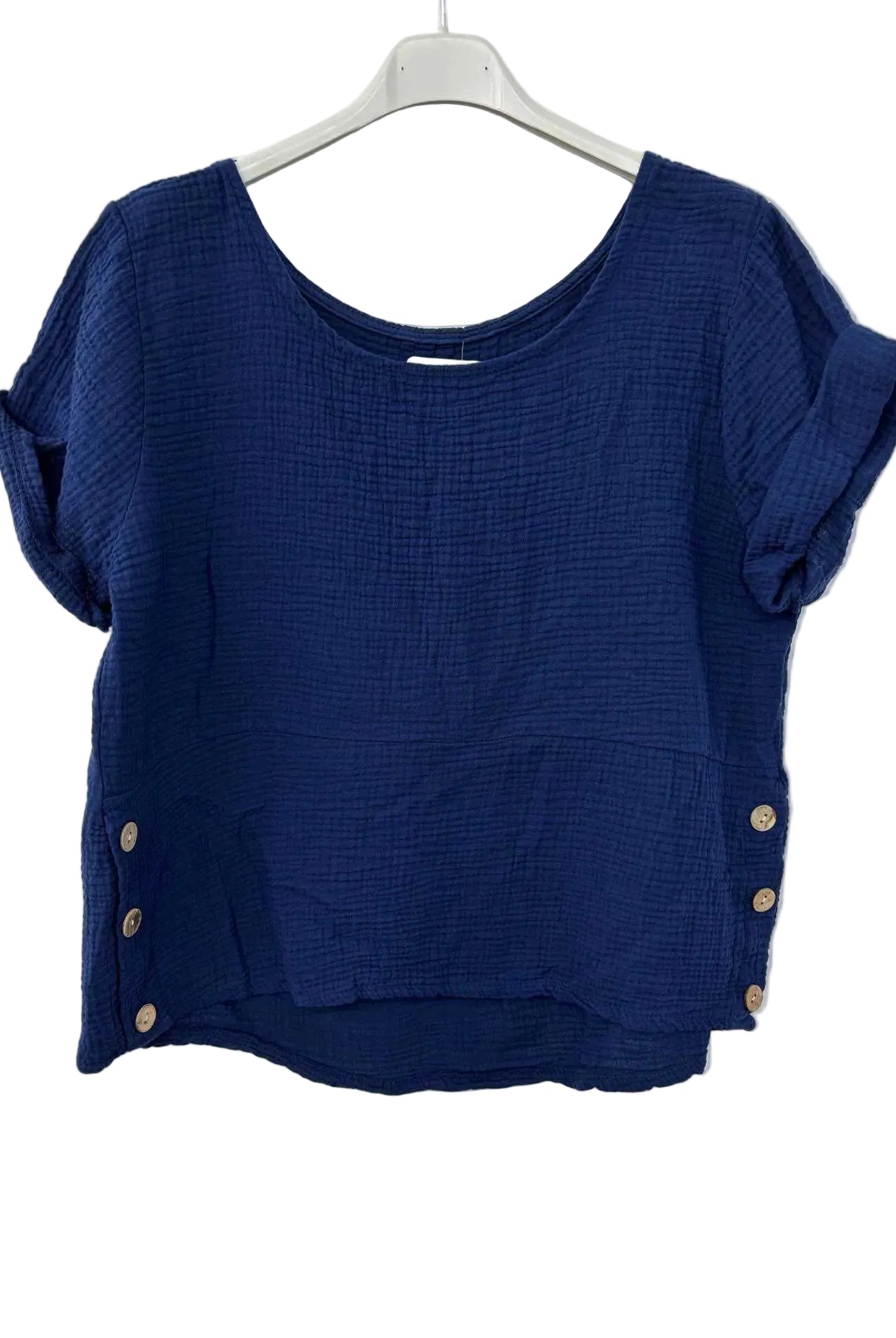 Blue textured top with button details on a white hanger
