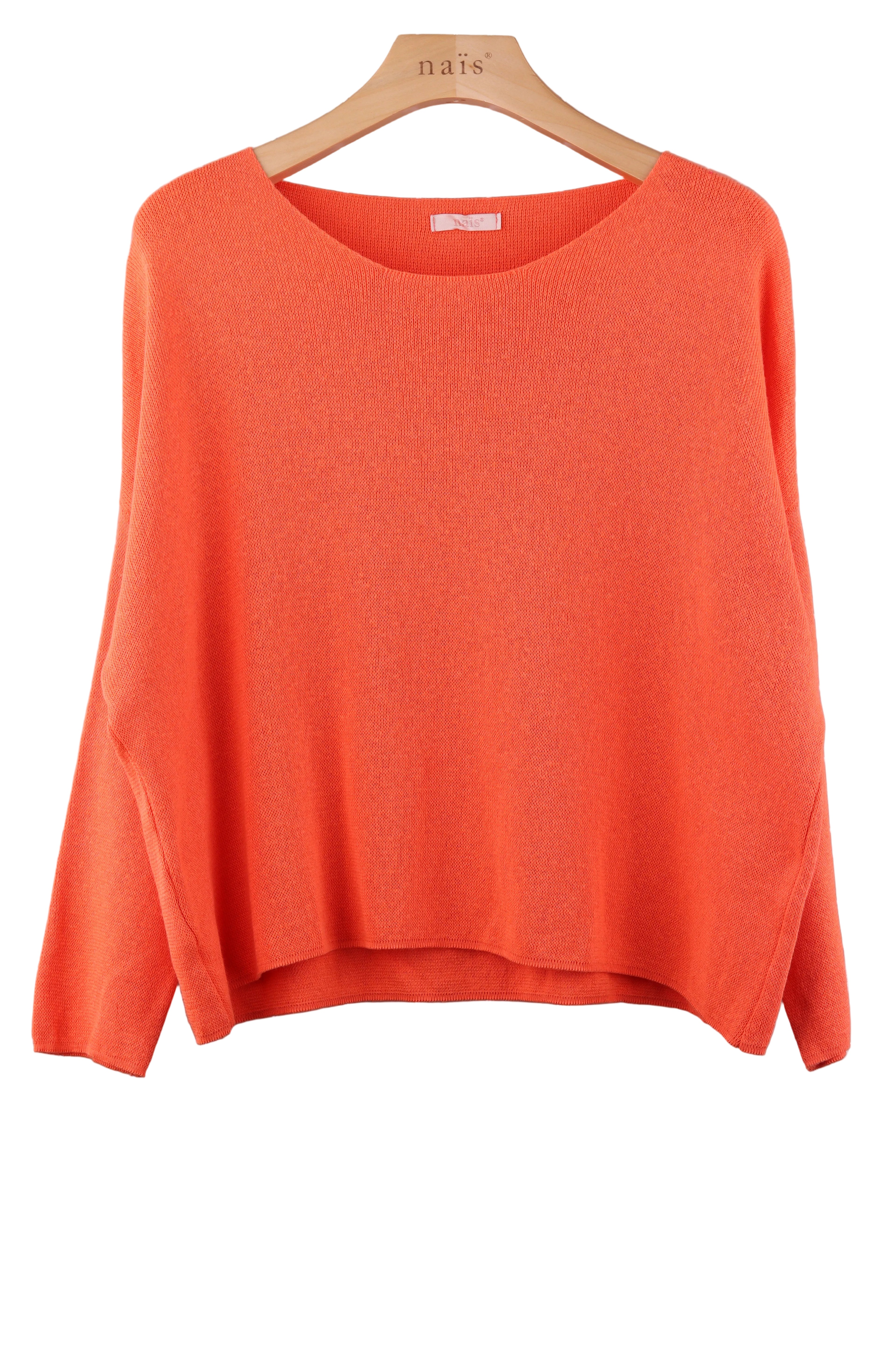 Orange sweater on a hanger against a white background