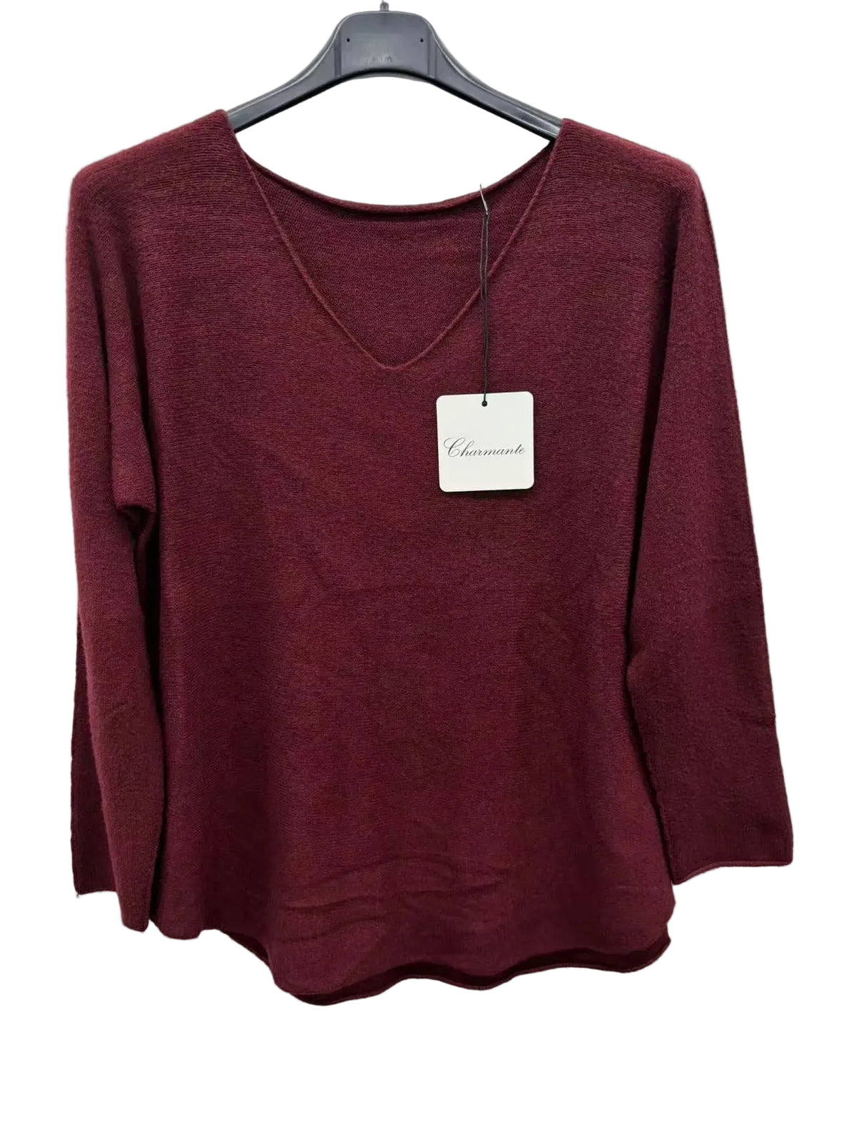 A women's long-sleeve knit sweater in a deep burgundy or maroon color, hanging on a black hanger against a plain white background.
