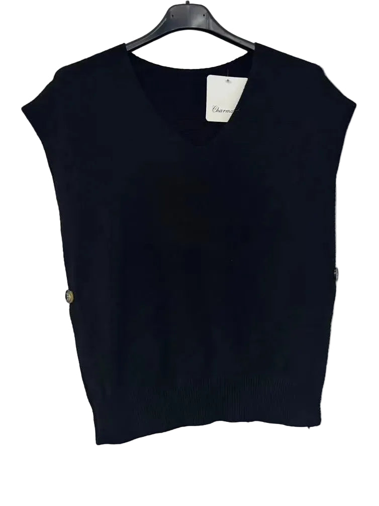 A sleeveless black knit V-neck sweater vest hanging on a black hanger against a plain white wall.
