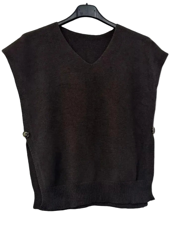 A dark brown sleeveless knit sweater vest with a V-neck and ribbed hem, hanging on a black hanger against a plain white wall.