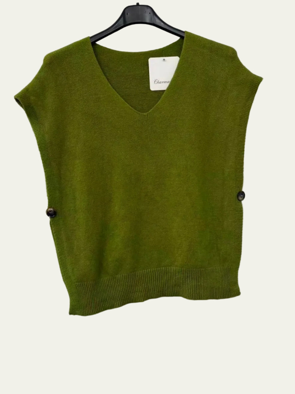 An olive green sleeveless V-neck knit sweater vest hanging on a black hanger against a white wall, featuring small dark buttons on the sides.