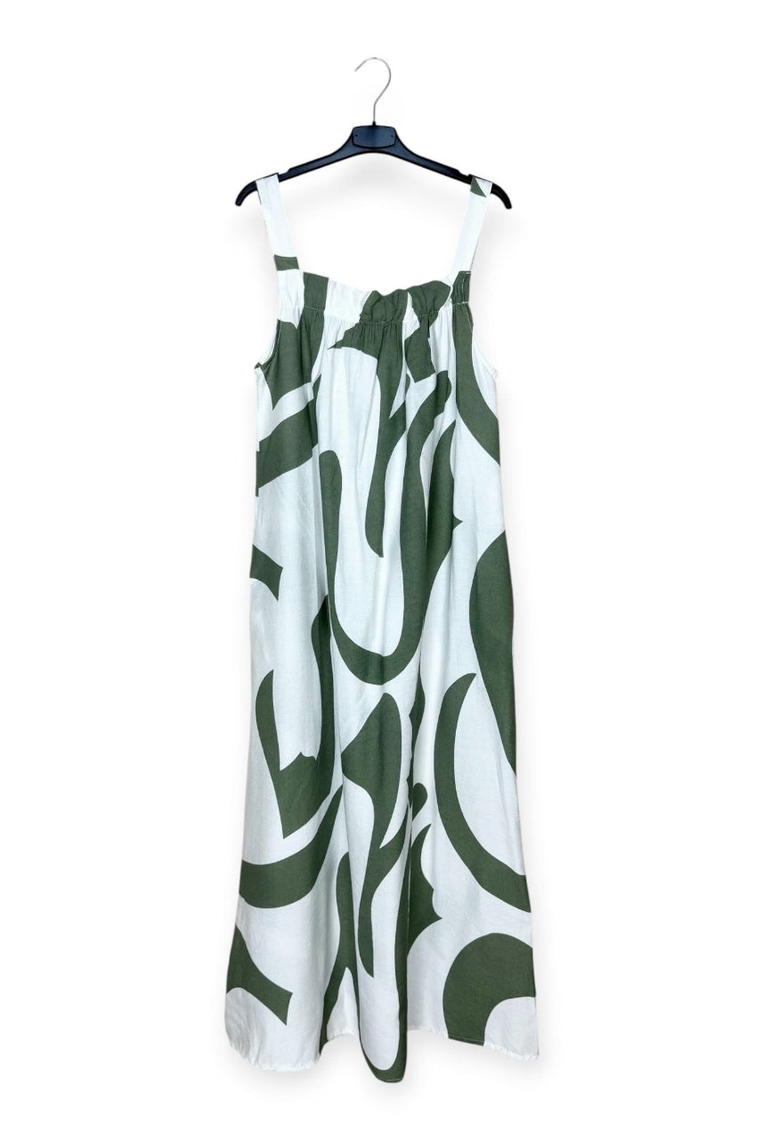 White dress with khaki abstract pattern on a hanger against a white background