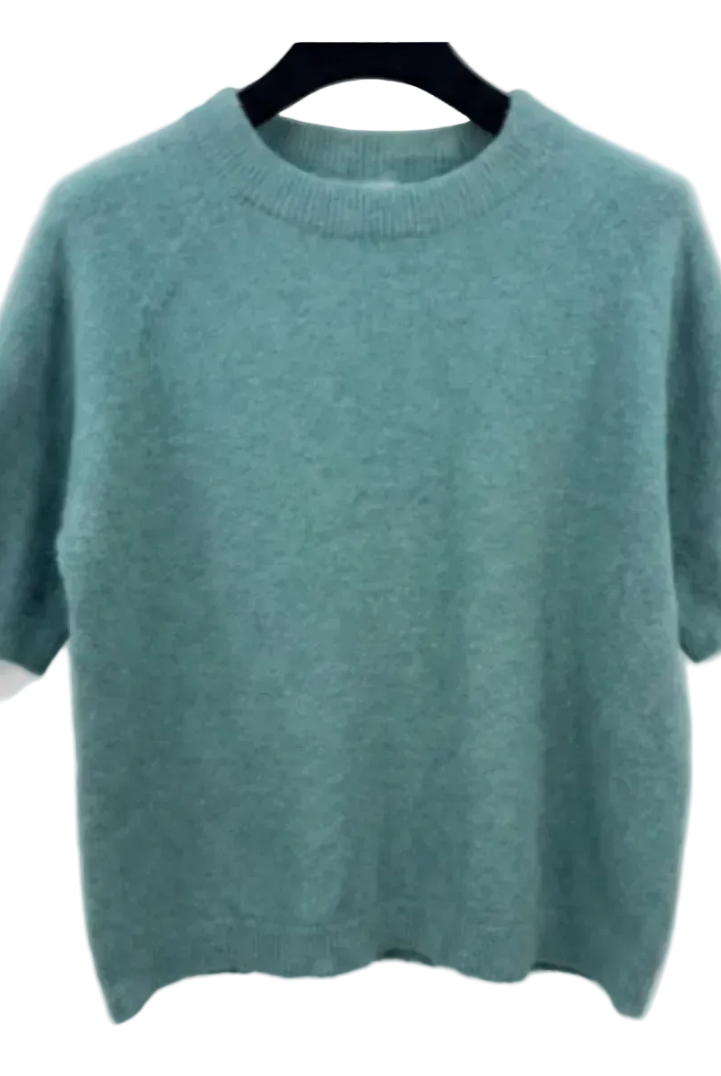 Ver D'Eau sweater on a hanger against a white background