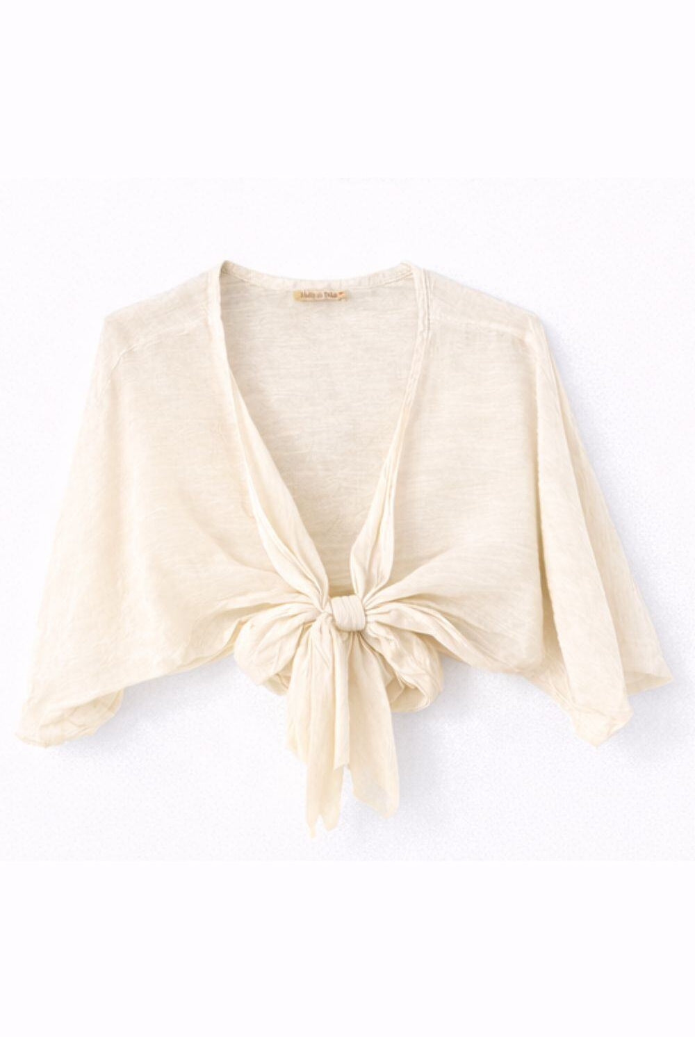 beige-colored cardigan with a knot detail on a white background