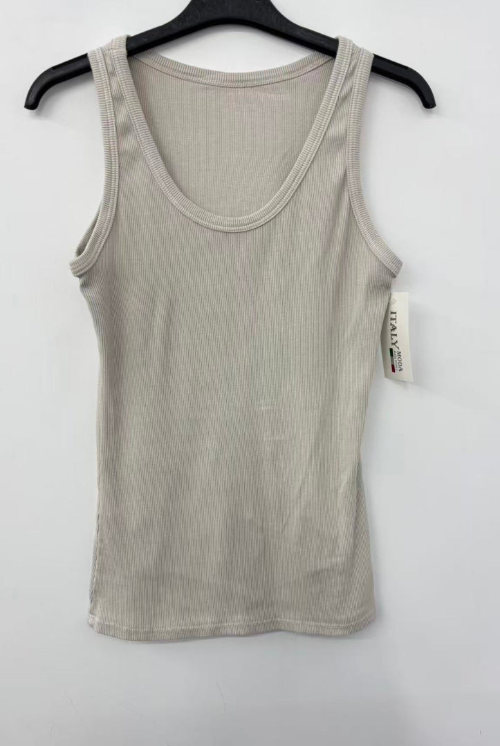 Beige tank top on a hanger against a white background