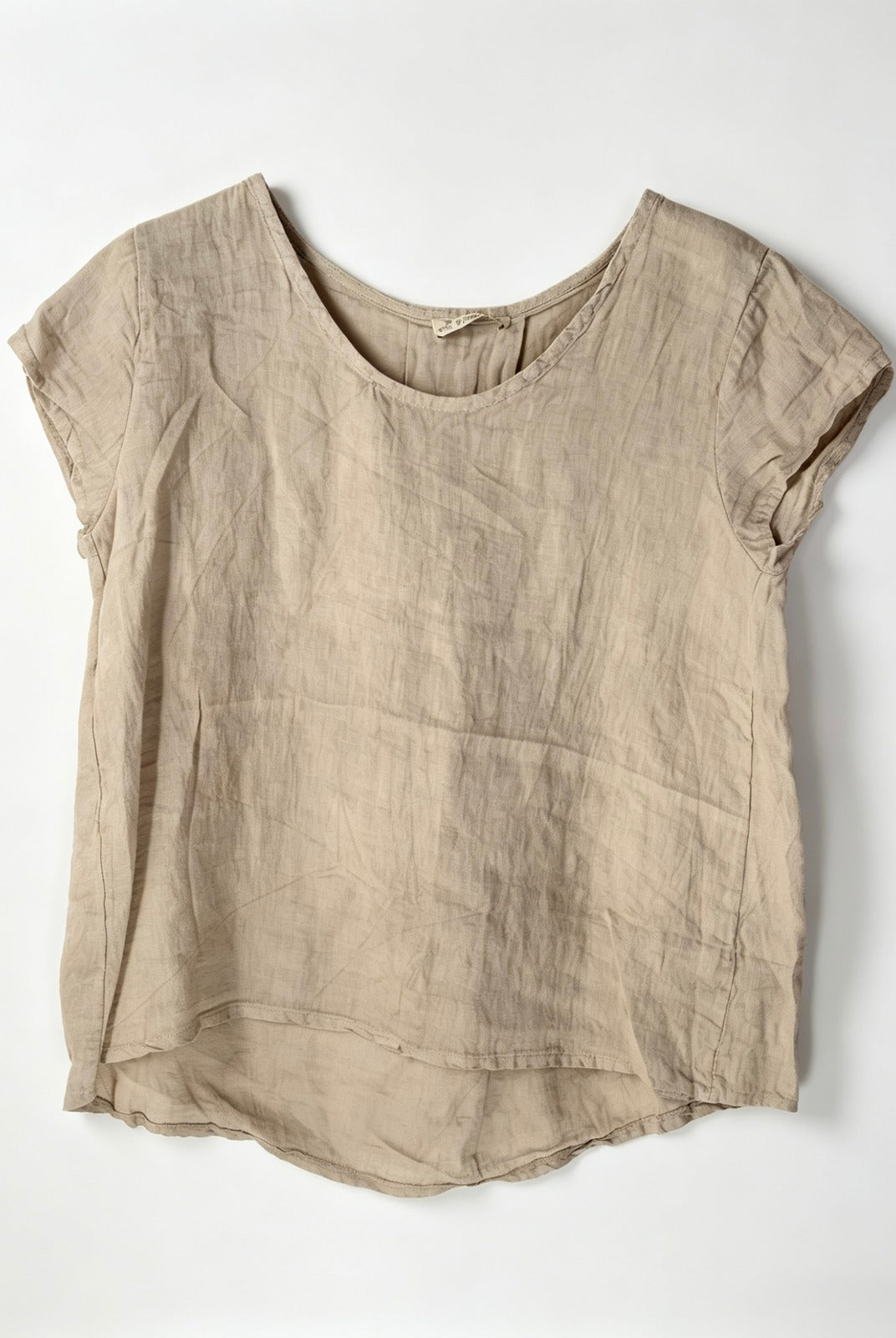 Beige linen top on a white background