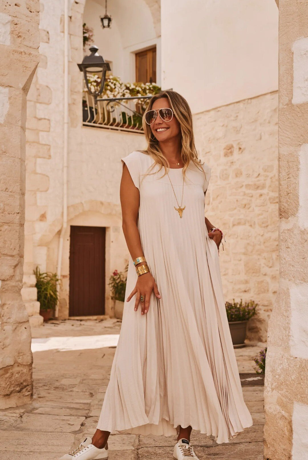 beige pleated dress