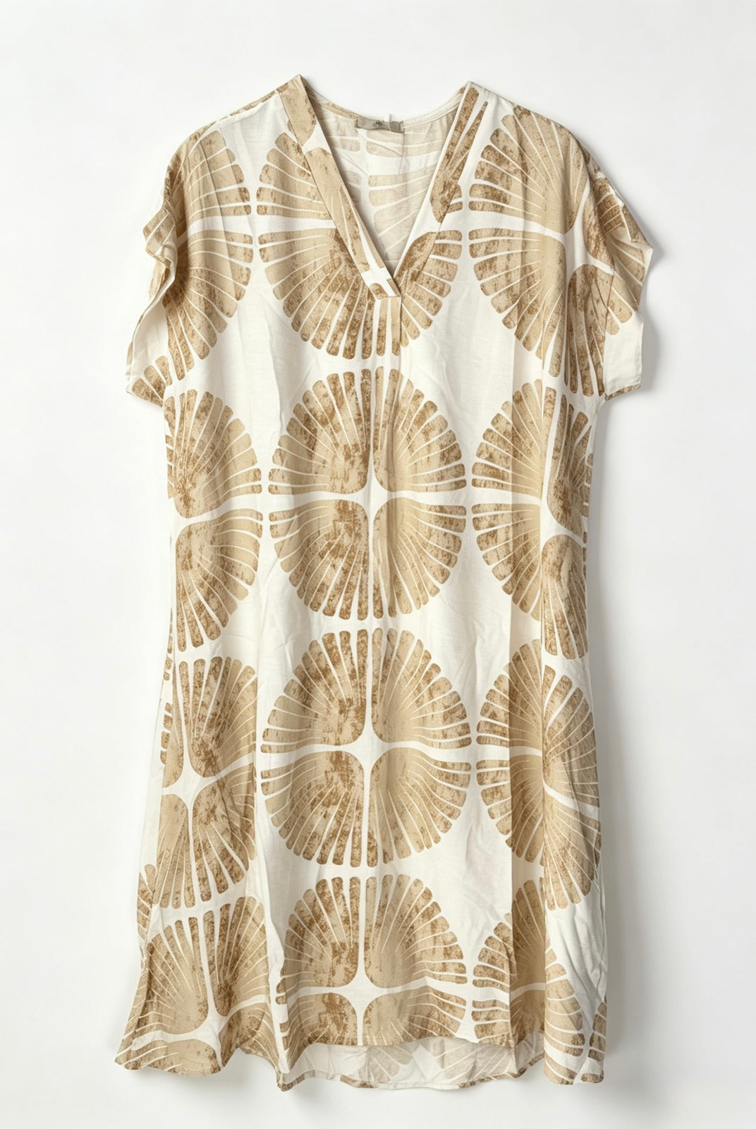 A short-sleeve V-neck dress featuring an all-over beige and cream circular fan-like pattern, displayed flat against a light off-white background.