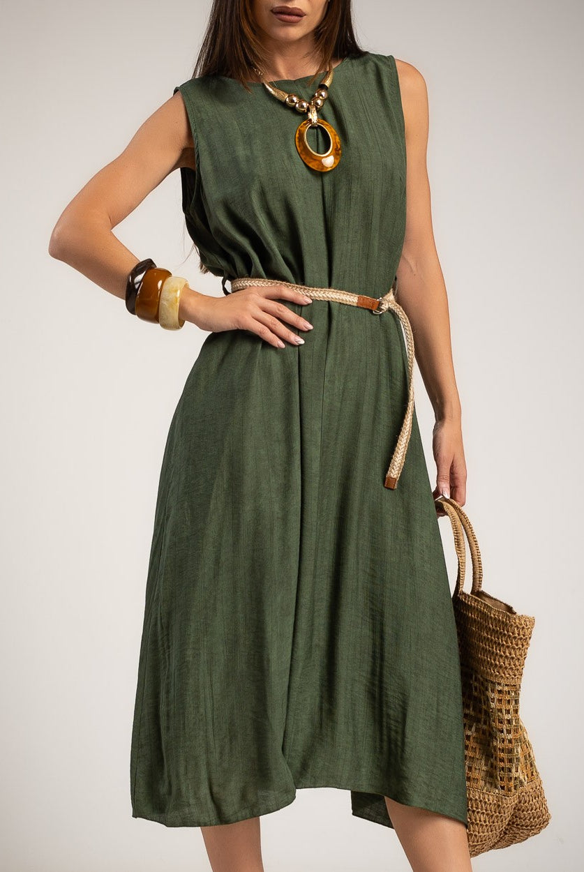A woman models a sleeveless olive green midi dress with a thin tan belt