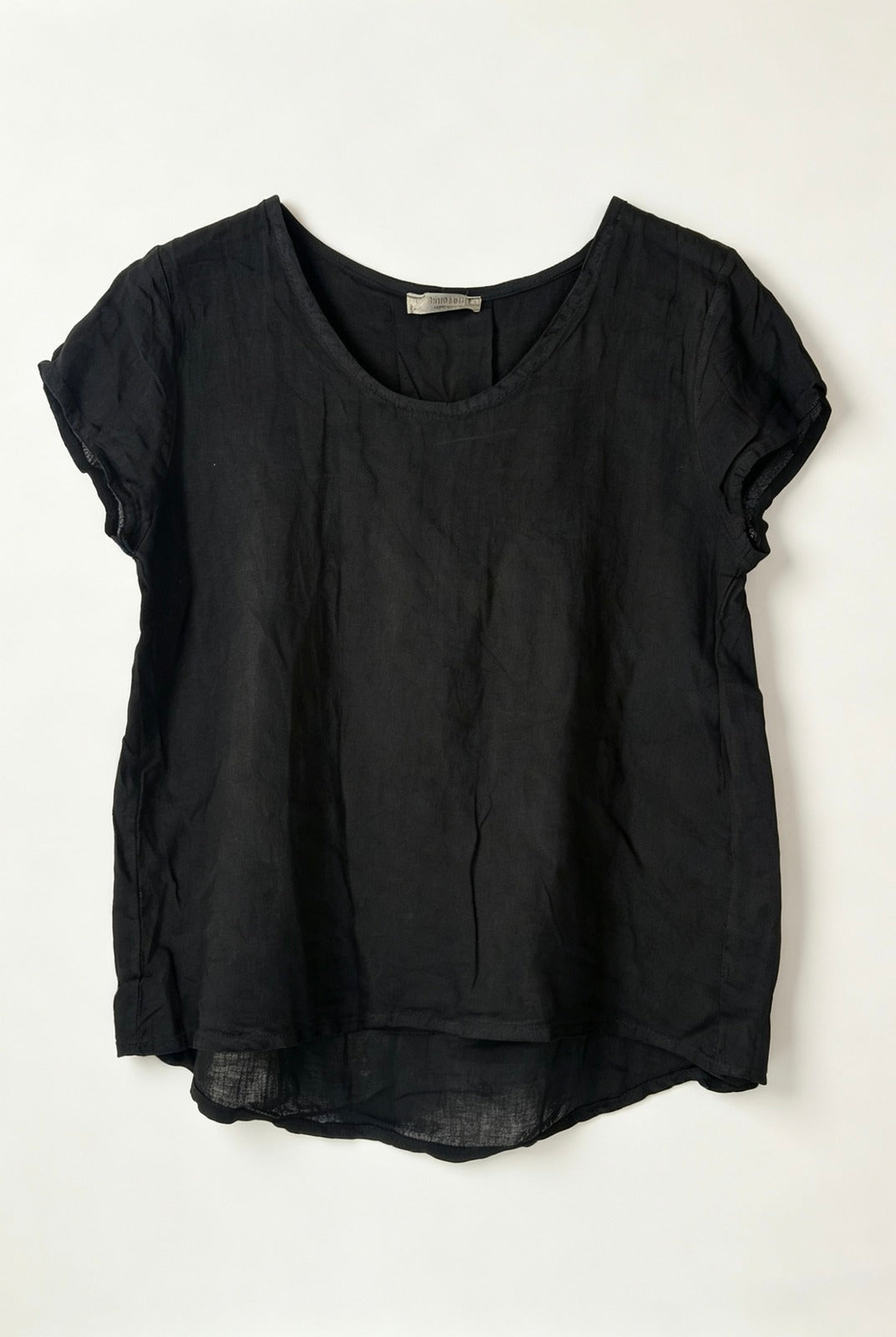 Black linen top on a white background