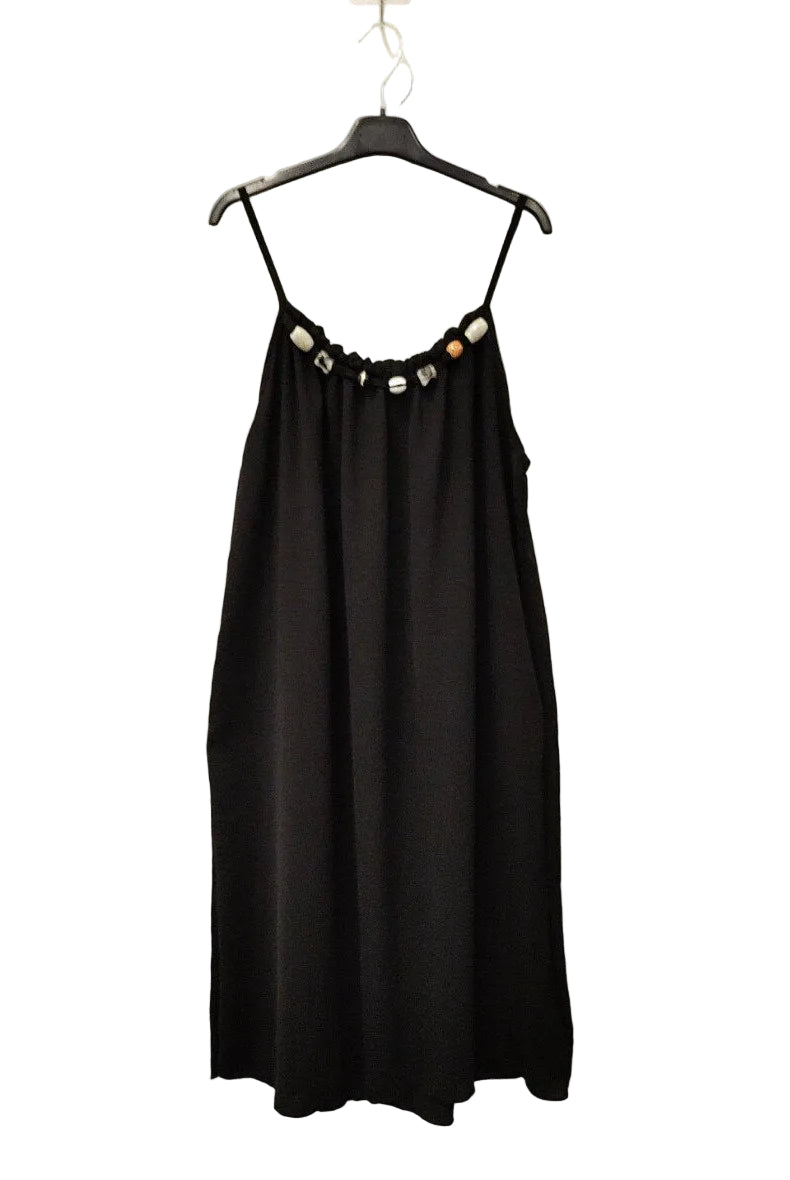 black strappy dress on plain background