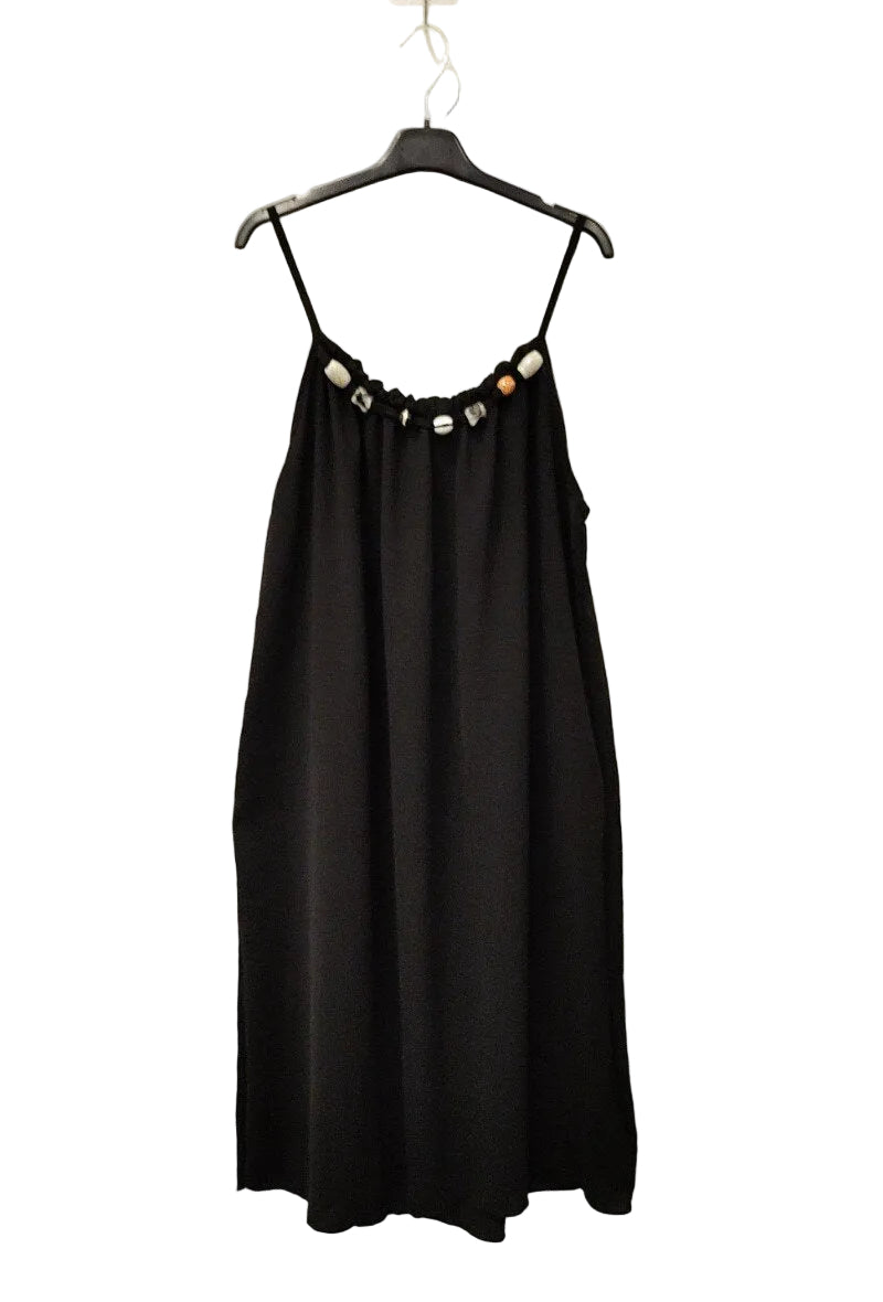black strappy dress on plain background