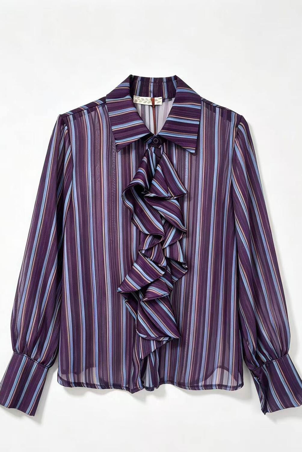 A purple and blue striped long-sleeve blouse with a ruffled front detail, displayed flat against a white background.
