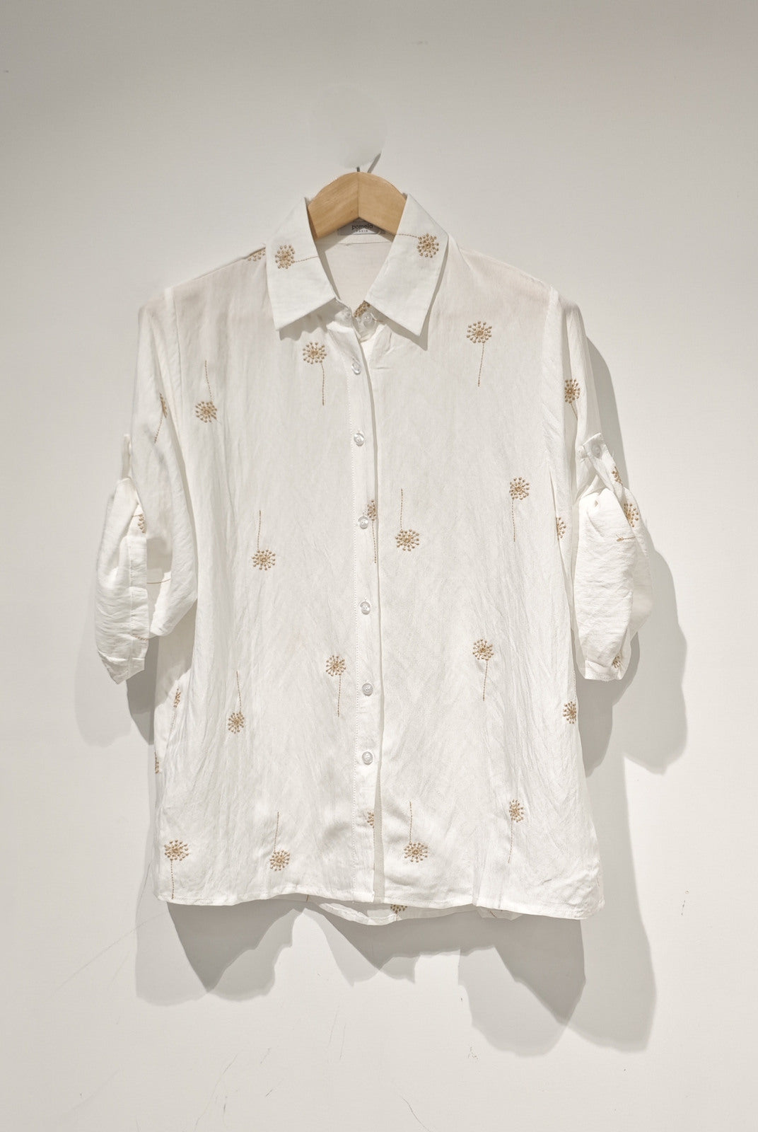 white embroidered shirt with roll up sleeves