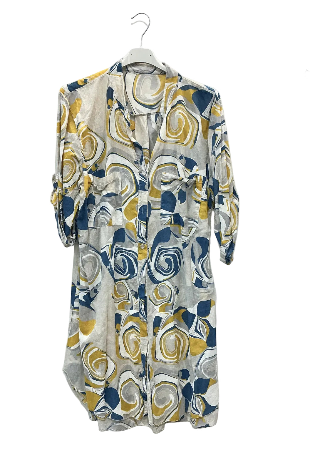 A lightweight button-front shirt dress with three-quarter sleeves, featuring an abstract swirl pattern in navy blue, mustard yellow, and white on a sheer fabric, hanging on a white hanger against a white wall.