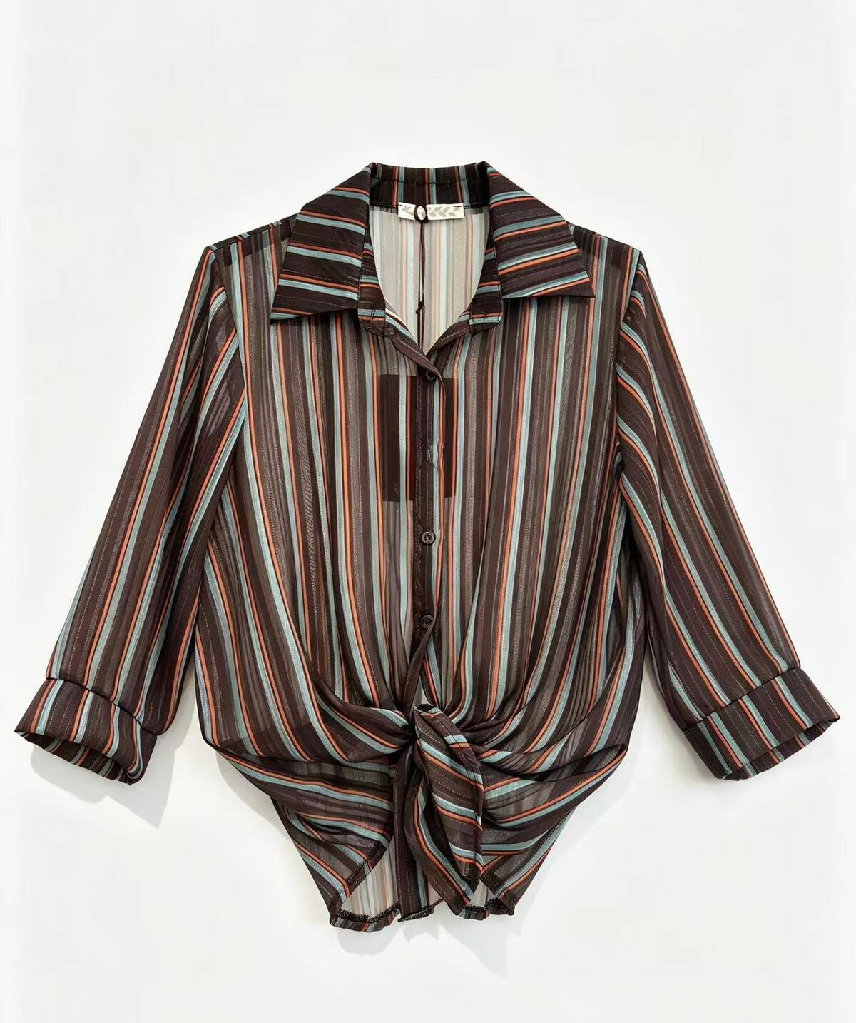 A long-sleeve button-up shirt with a vertical stripe pattern in featuring a pointed collar