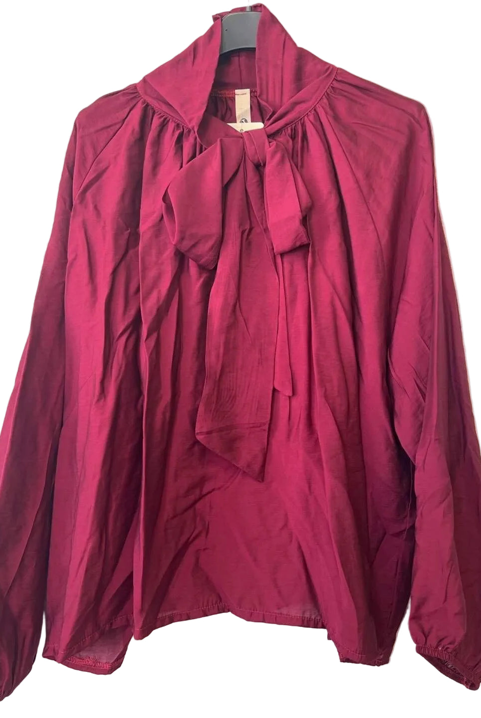 A long-sleeve blouse in deep burgundy with a high collar and a large front bow tie,