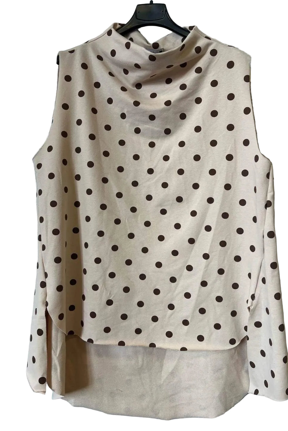 A sleeveless beige cowl-neck blouse with a brown polka dot pattern