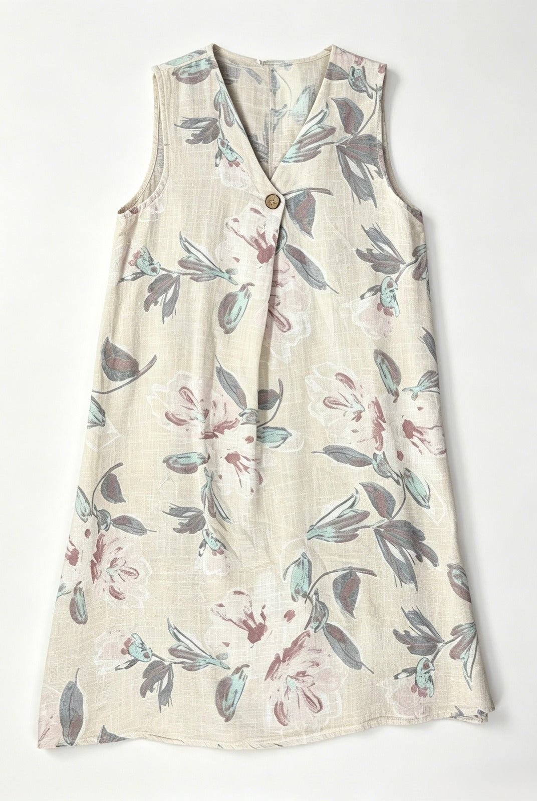 A sleeveless V-neck dress with a button-up front, featuring an ecru cotton fabric