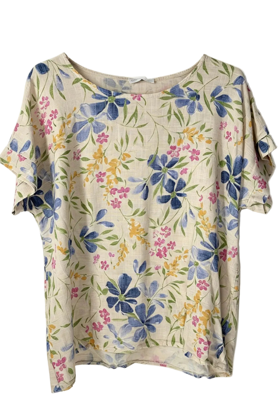A short-sleeve top with a cream-colored base and a watercolor-style floral print featuring blue, pink, and yellow flowers with green leaves.