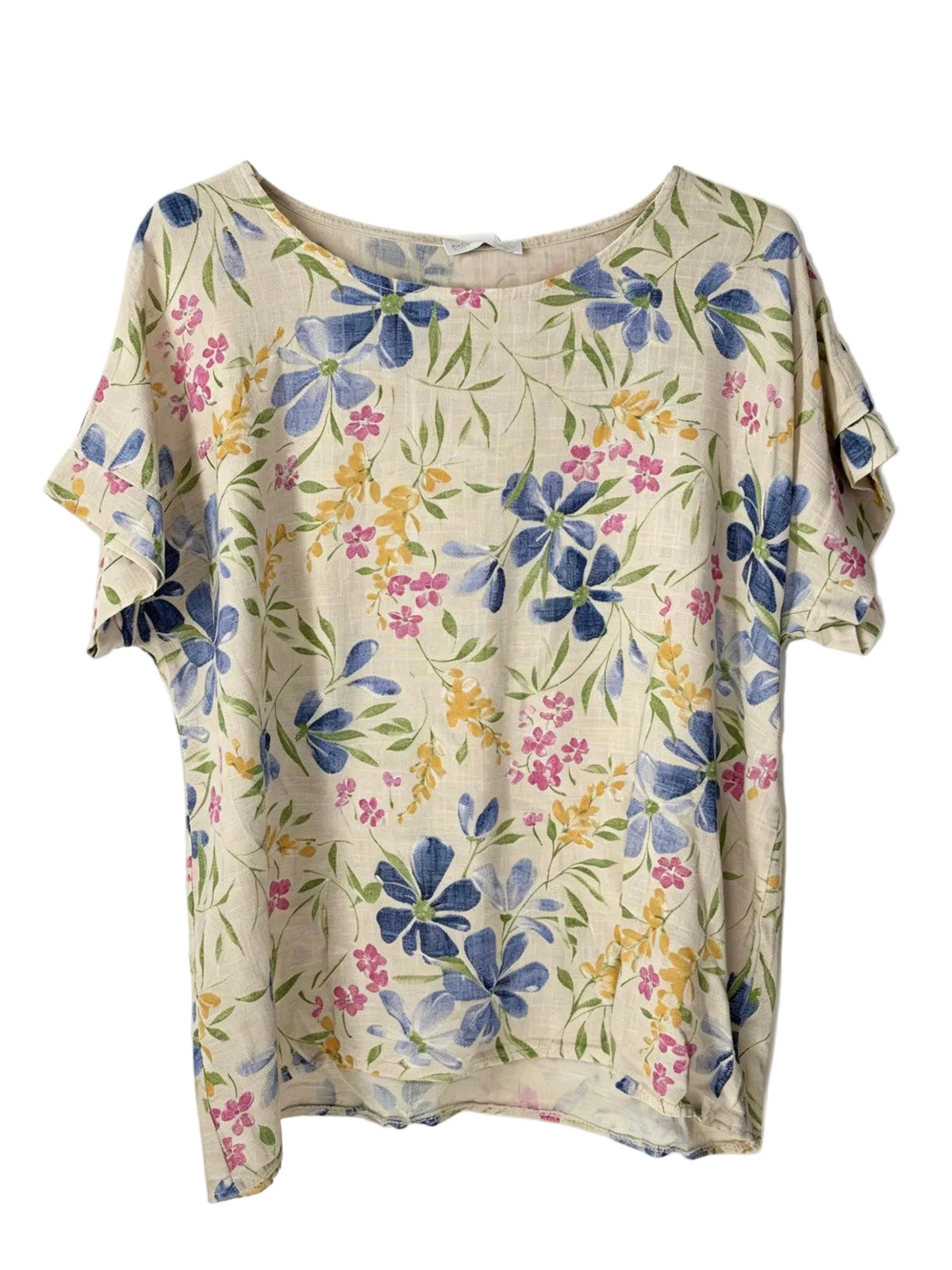 A short-sleeve top with a cream-colored base and a watercolor-style floral print featuring blue, pink, and yellow flowers with green leaves.