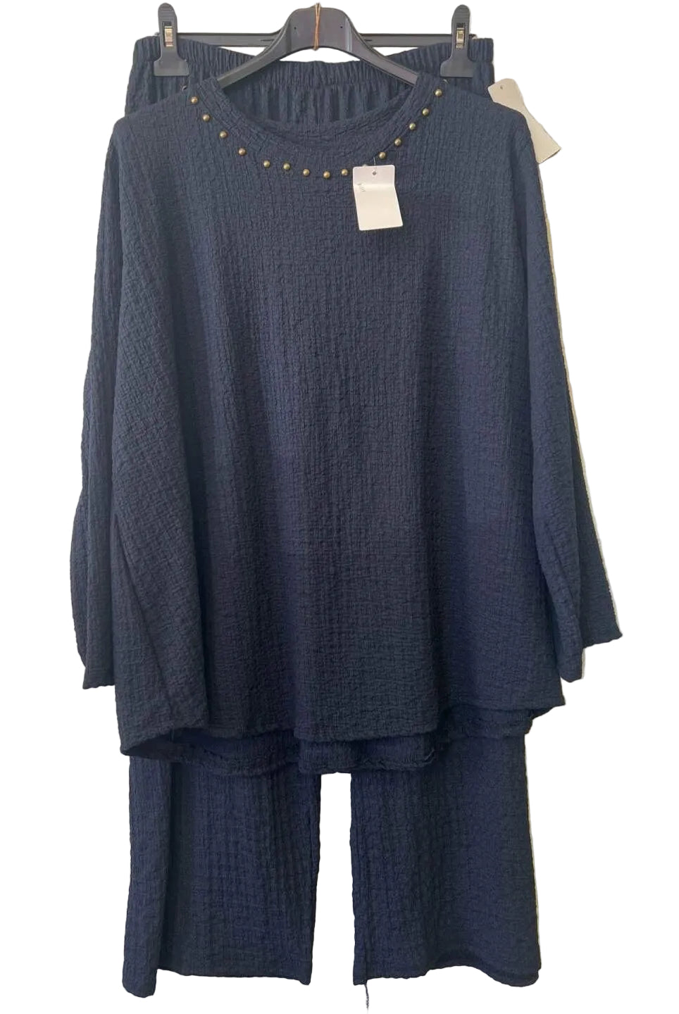 A dark navy blue two-piece lounge set consisting of a textured long-sleeve top with gold stud detailing around the neckline and matching textured pants,