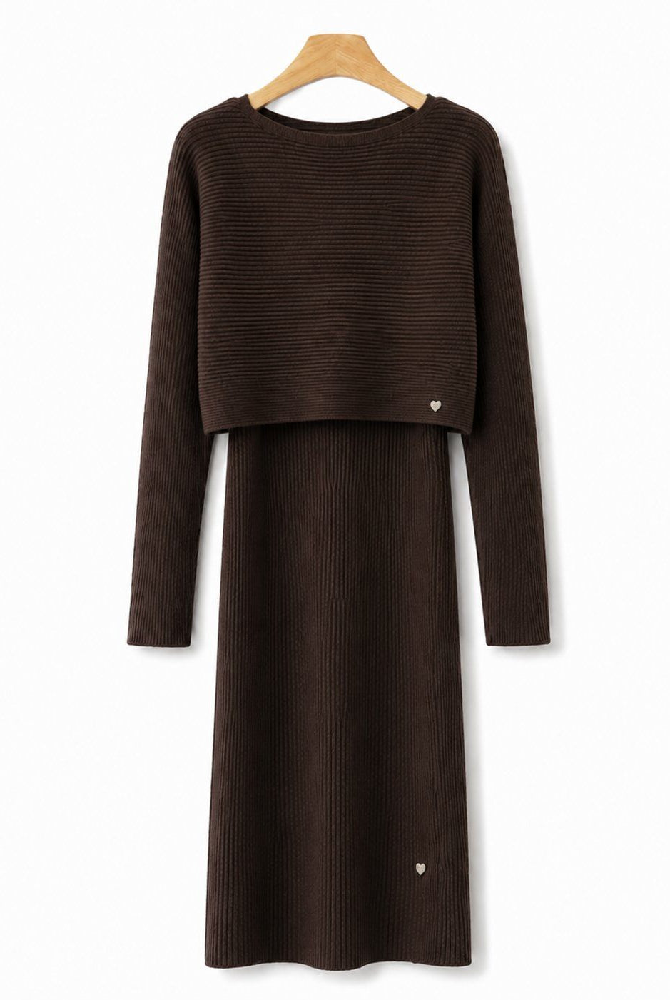A dark brown ribbed knit long-sleeve dress with a cropped long-sleeve top overlay, hanging on a wooden hanger against a plain white background.