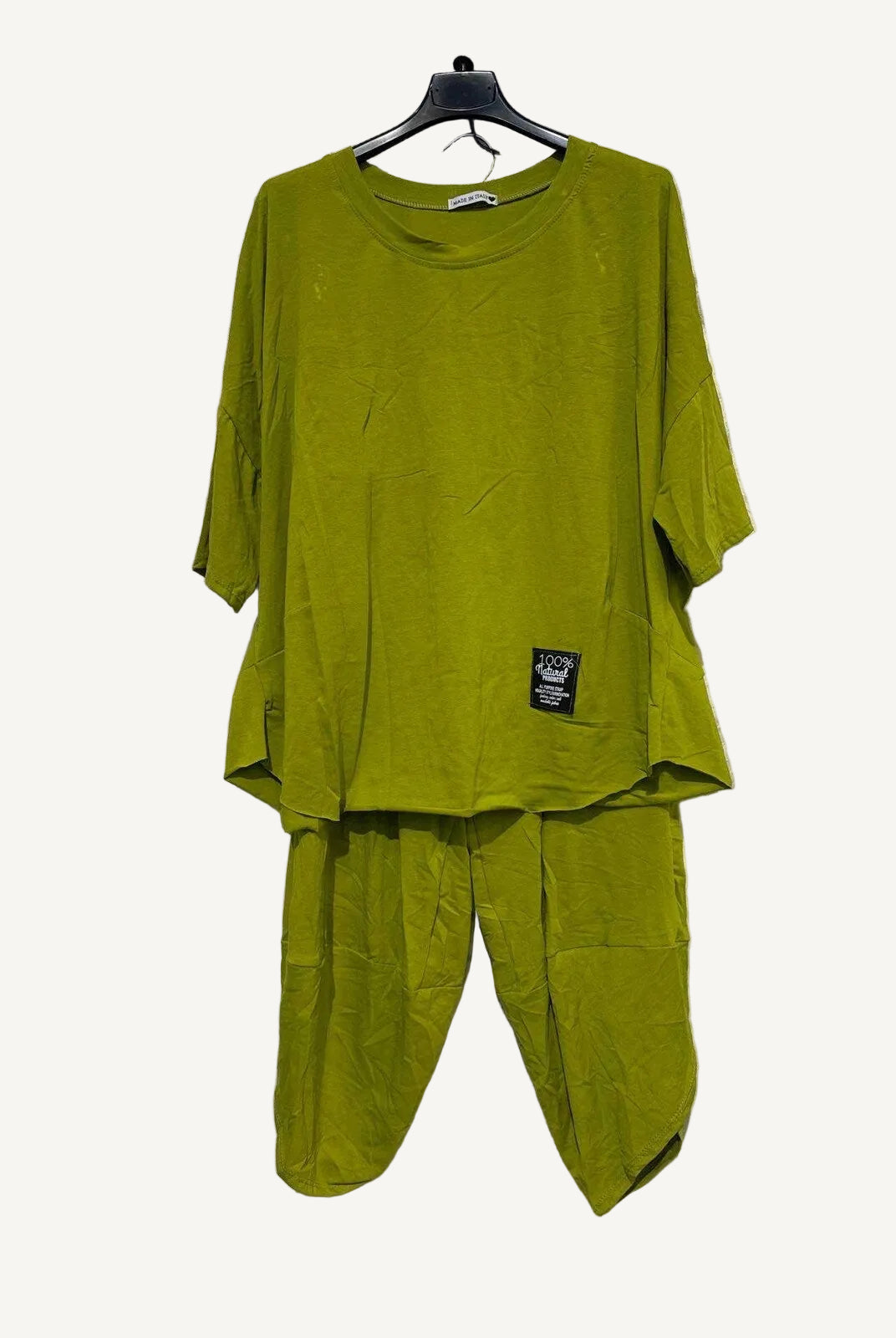 Olive two piece top and trouser set on a hanger