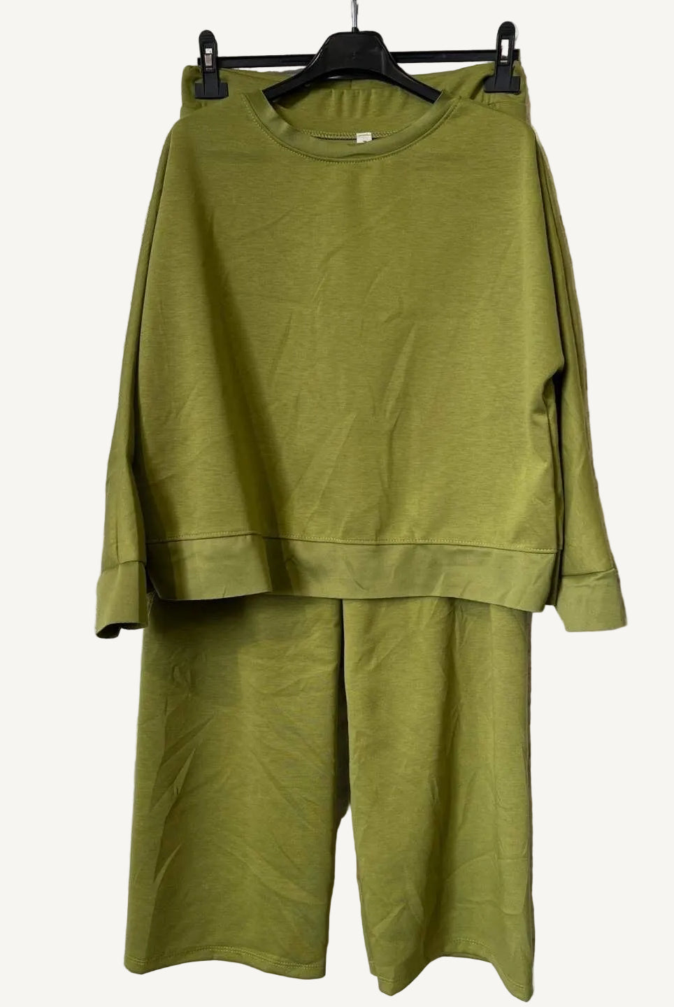 Olive Green outfit on a hanger