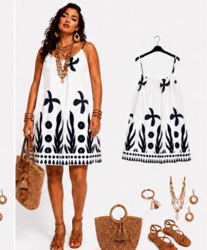Woman wearing a white dress with black patterns,